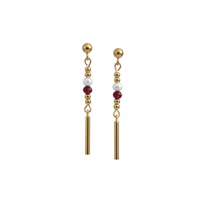 Florence by the Ocean gold drop earrings with white pearls and ruby-red crystal beads on a minimalist bar silhouette.