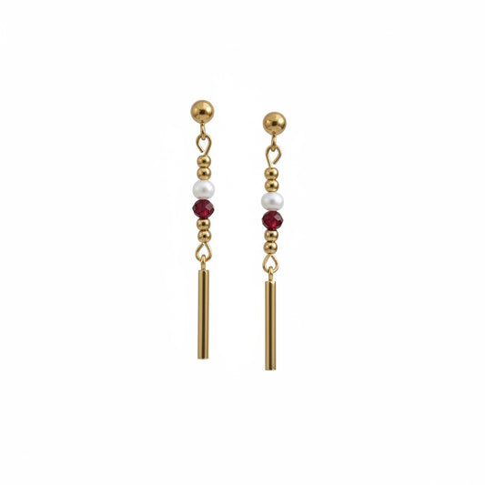 Florence by the Ocean gold drop earrings with white pearls and ruby-red crystal beads on a minimalist bar silhouette.